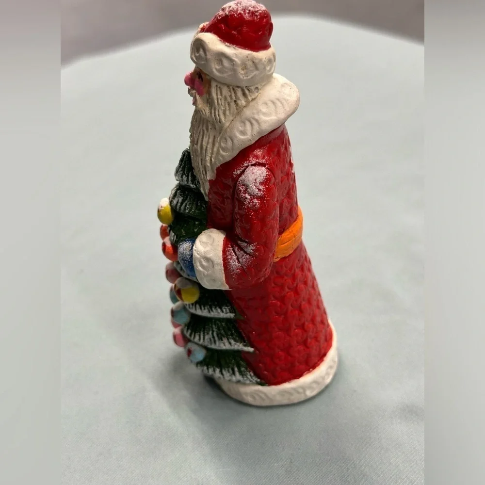 Resin Santa figure carries a special greeting